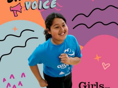 Girls on the Run participant smiles at the camera